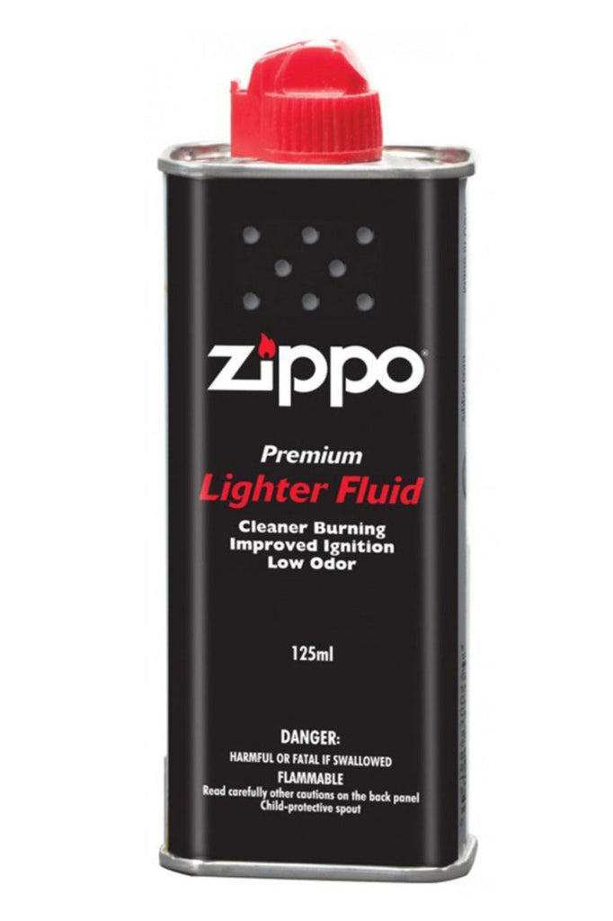 Zippo Premium Lighter Fluid can with a red cap and black body, featuring white and red text describing its cleaner burning, improved ignition, and low odor properties. Capacity and safety warnings are also displayed.